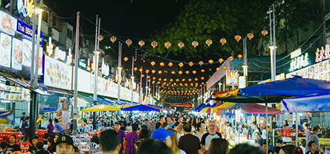 Tourists and local people visiting and eating at Jalan Alor street, Bukit Bintang, Kuala Lumpur, Malaysia